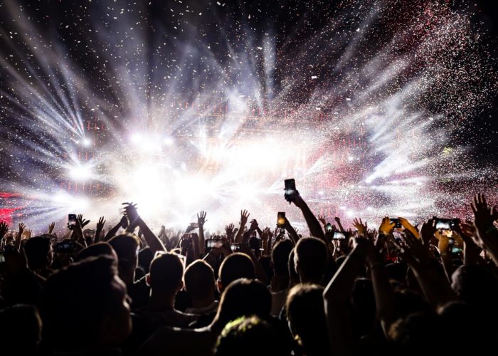 excited-audience-watching-confetti-fireworks-having-fun-music-festival-night-copy-space
